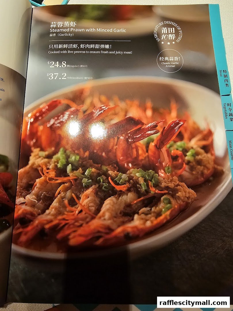 A menu page featuring Steamed Prawn with Minced Garlic, with prices and descriptions.