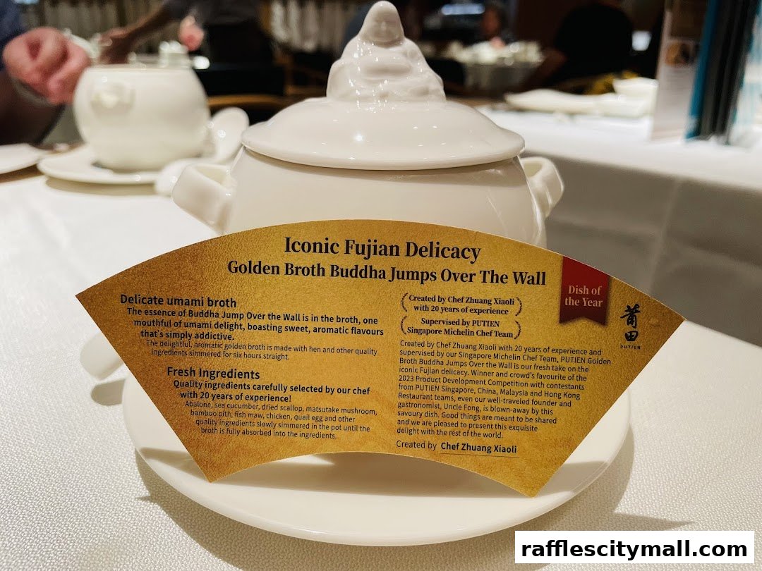 A close-up of a decorative fan-shaped menu describing a Fujian delicacy at PUTIEN.