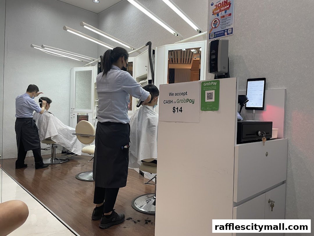 Barbers cutting hair in a modern salon with bright lighting and clean white interiors.