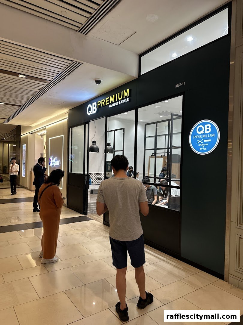 QB Premium Haircut & Style shop front with customers waiting outside.