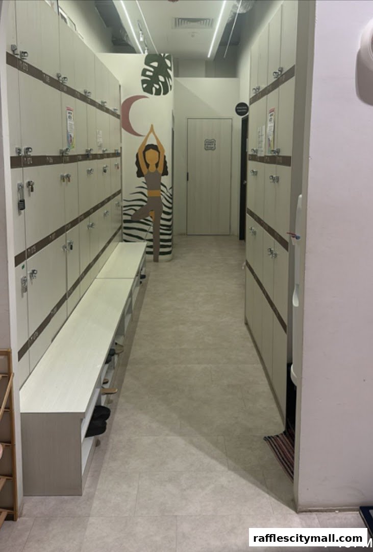 A clean and modern locker room with benches and shoe storage at Real Yoga Premium.