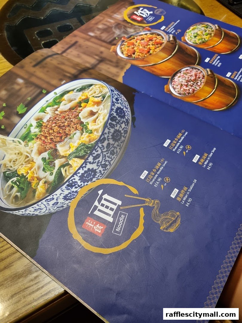A menu from Riverside Canton Claypot Cuisine featuring noodle dishes and other food items.