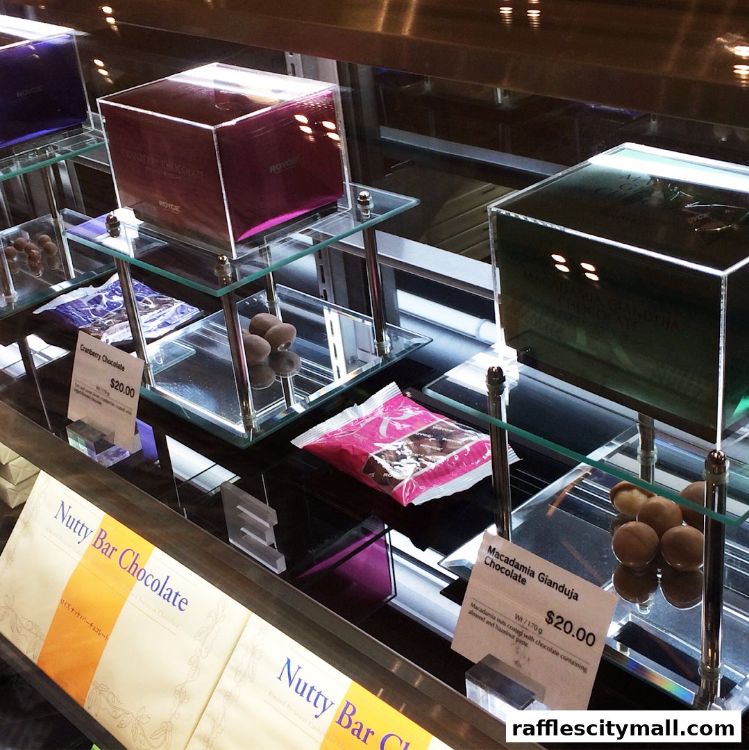 A display case filled with various Royce chocolates, including cranberry and macadamia gianduja.