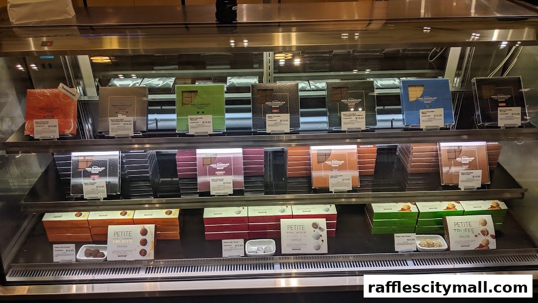 A display case filled with various Royce chocolate bars and truffles.