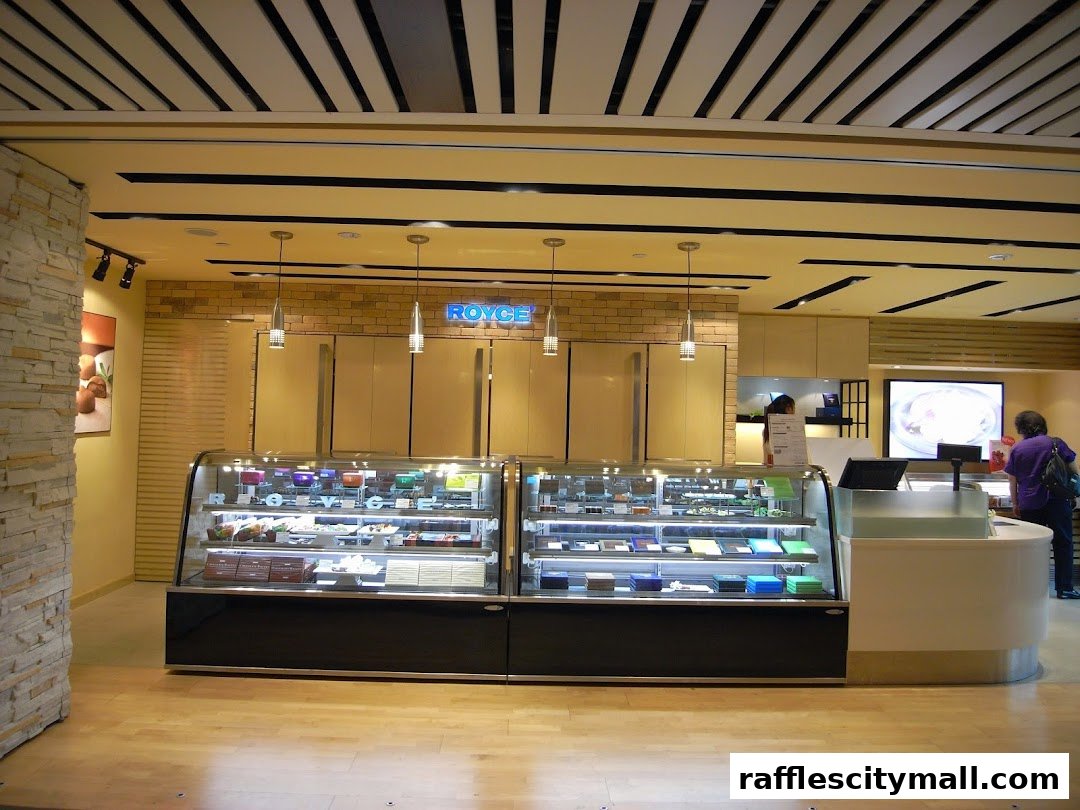 A Royce chocolate shop with display cases filled with chocolates and a cashier counter.