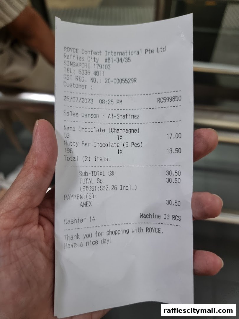 A receipt from Royce Confect International showing purchased chocolates and payment details.