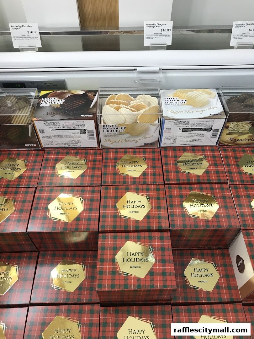 Royce potato chip chocolates and holiday gift boxes displayed in a retail setting.