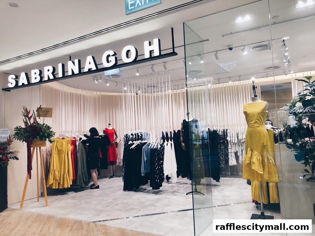 A fashion boutique displays dresses on racks and mannequins, with a customer browsing.