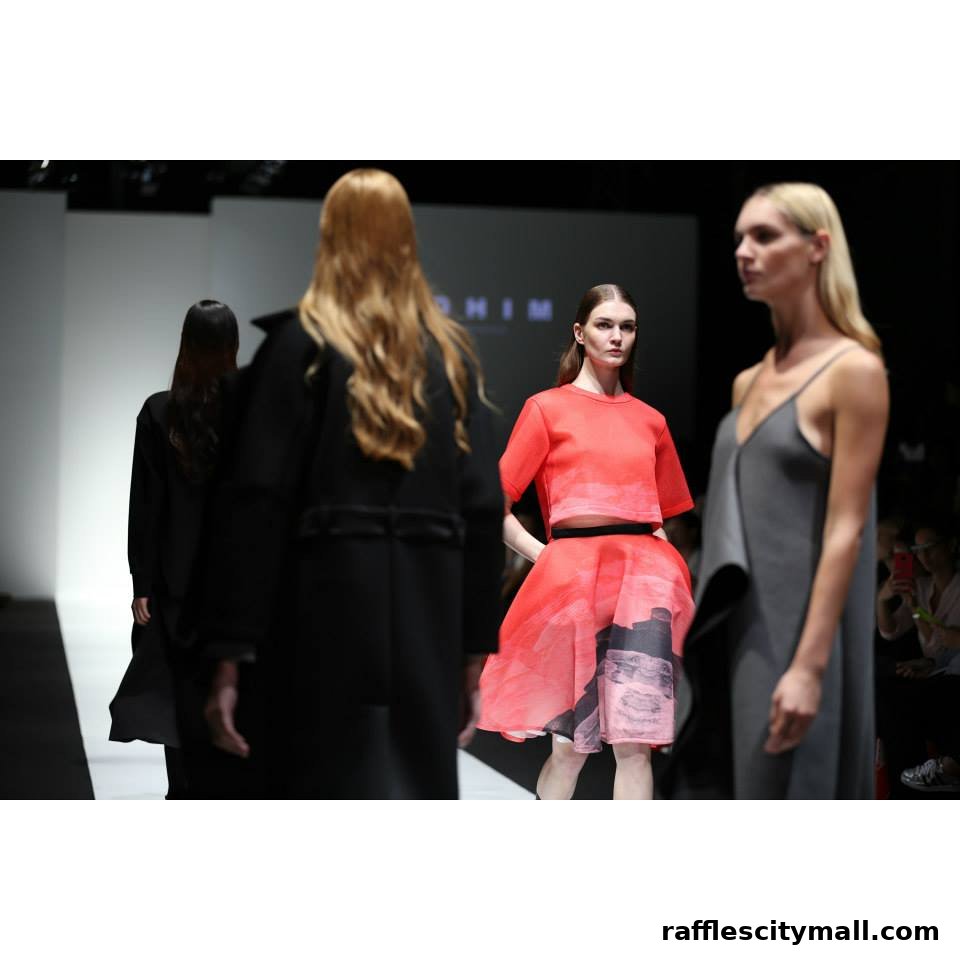 Models showcase designer outfits on a fashion runway.