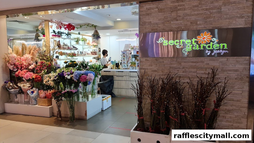A flower shop called Secret Garden, showcasing a vibrant display of fresh flowers and decorative branches.