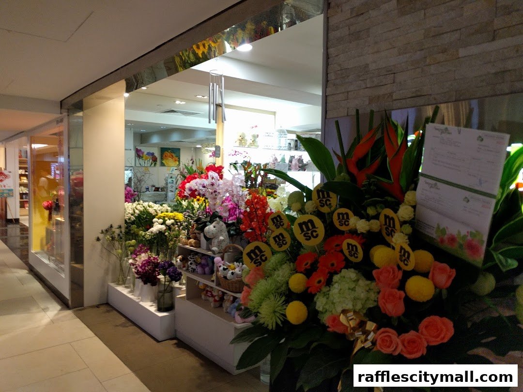 A vibrant flower shop display featuring a variety of colorful blooms and decorative items.