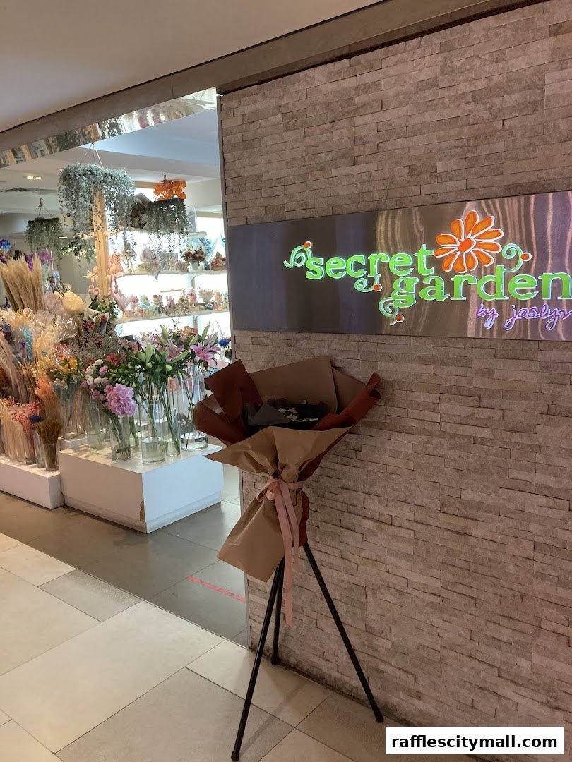 The entrance to Secret Garden flower shop, featuring a bouquet on display and a sign.