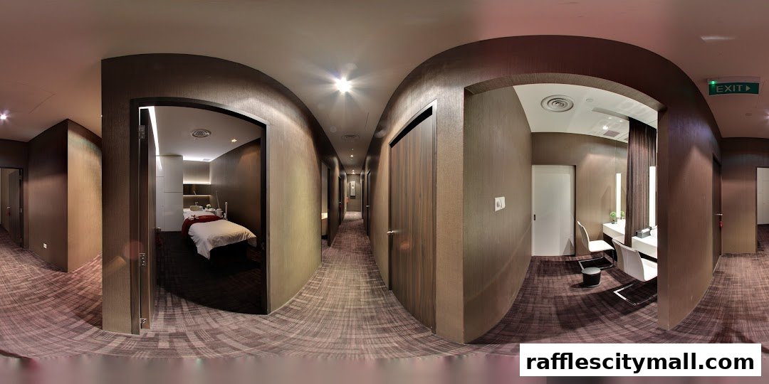 Interior view of a spa hallway with treatment rooms and a vanity area.