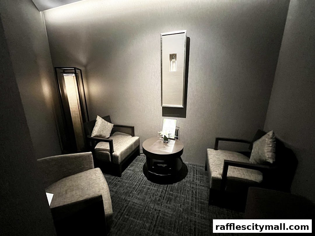 A serene waiting area with comfortable chairs, a coffee table, and ambient lighting.