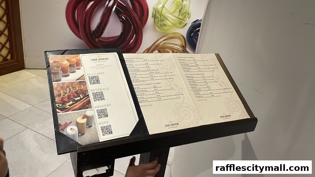 A menu stand displaying various North Indian dishes and beverages with images.