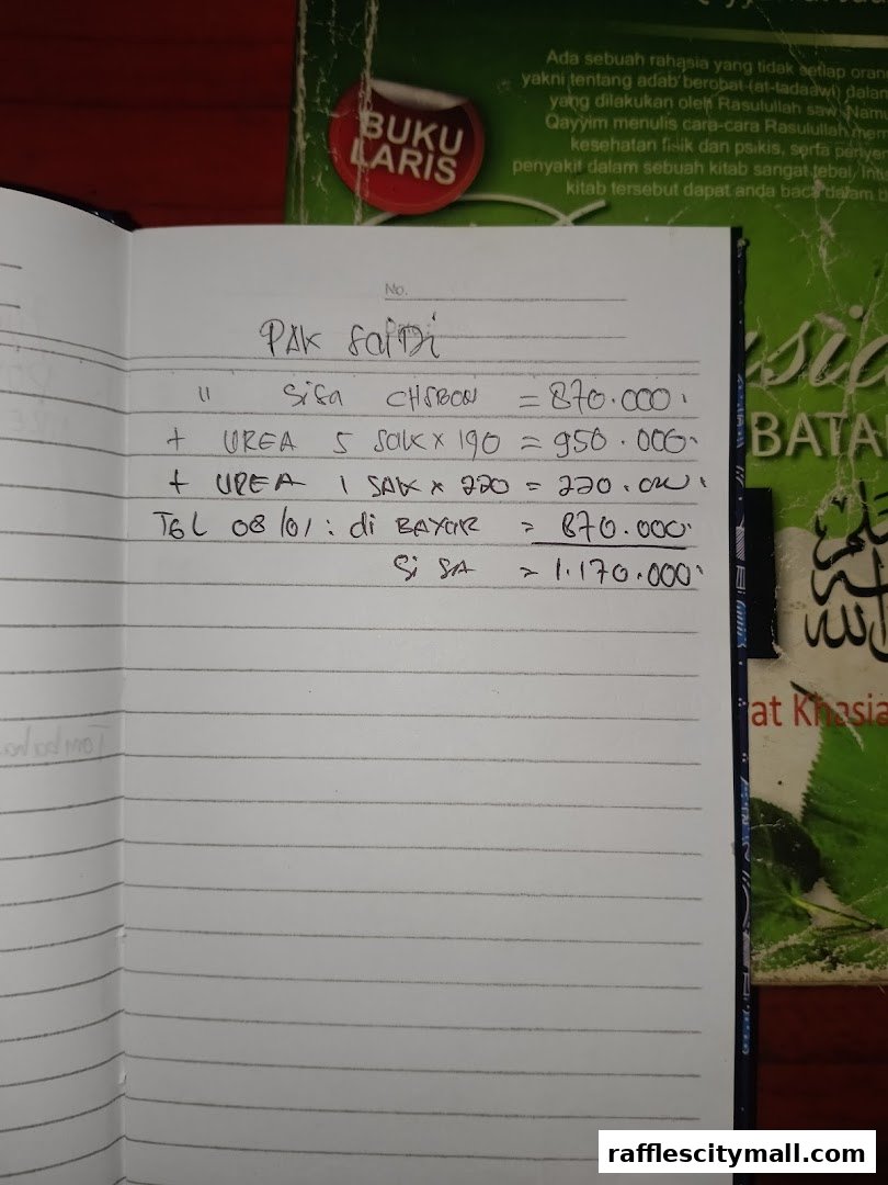 A handwritten ledger entry detailing purchases and payments, with books in the background.