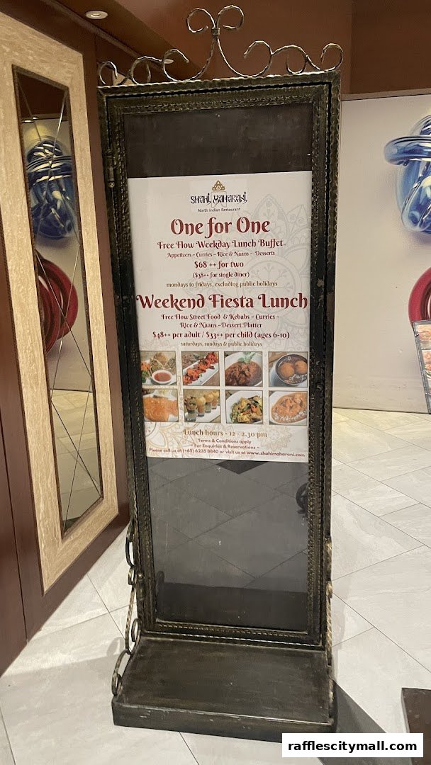 A sign advertising a 'One for One' weekday lunch buffet and 'Weekend Fiesta Lunch' at Shahi Maharani North Indian Restaurant.
