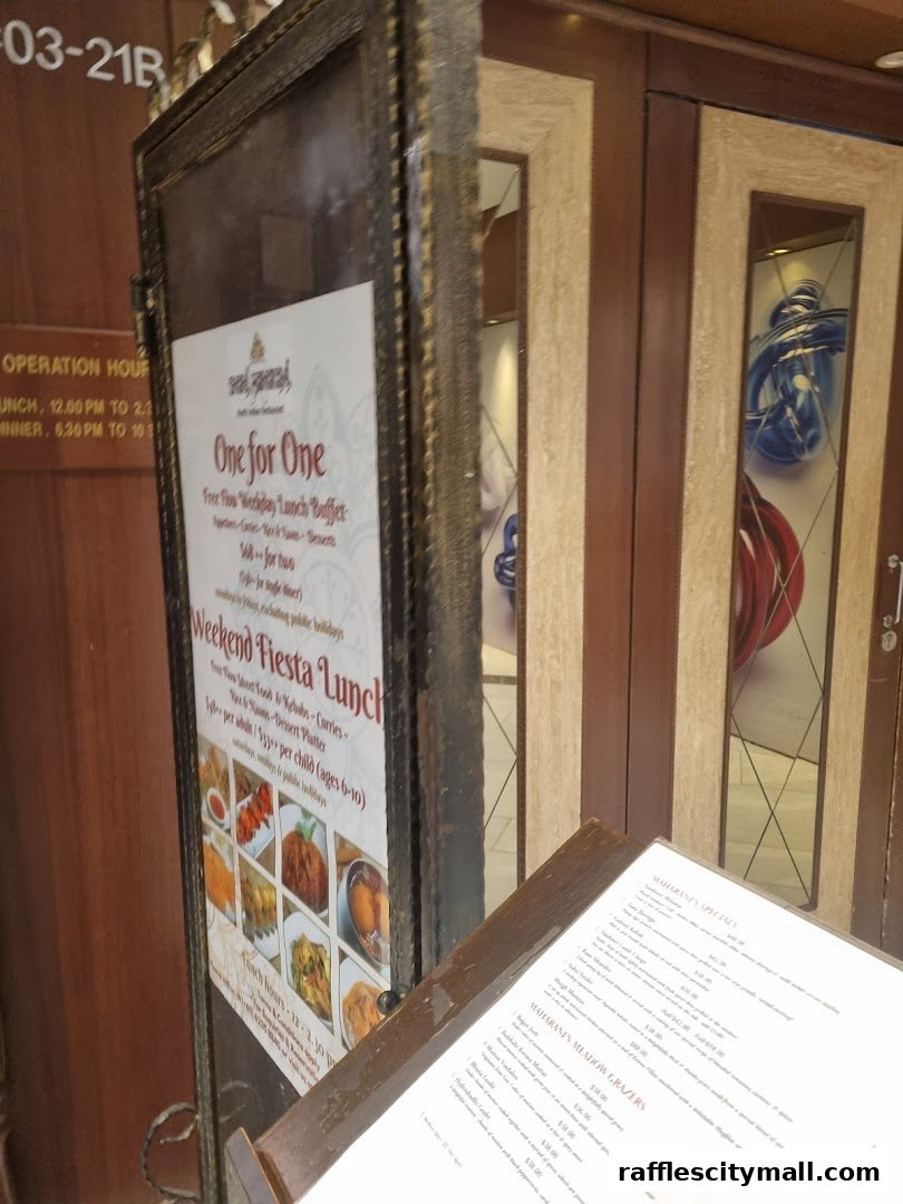 A restaurant entrance with a framed menu board and a separate menu on a stand.