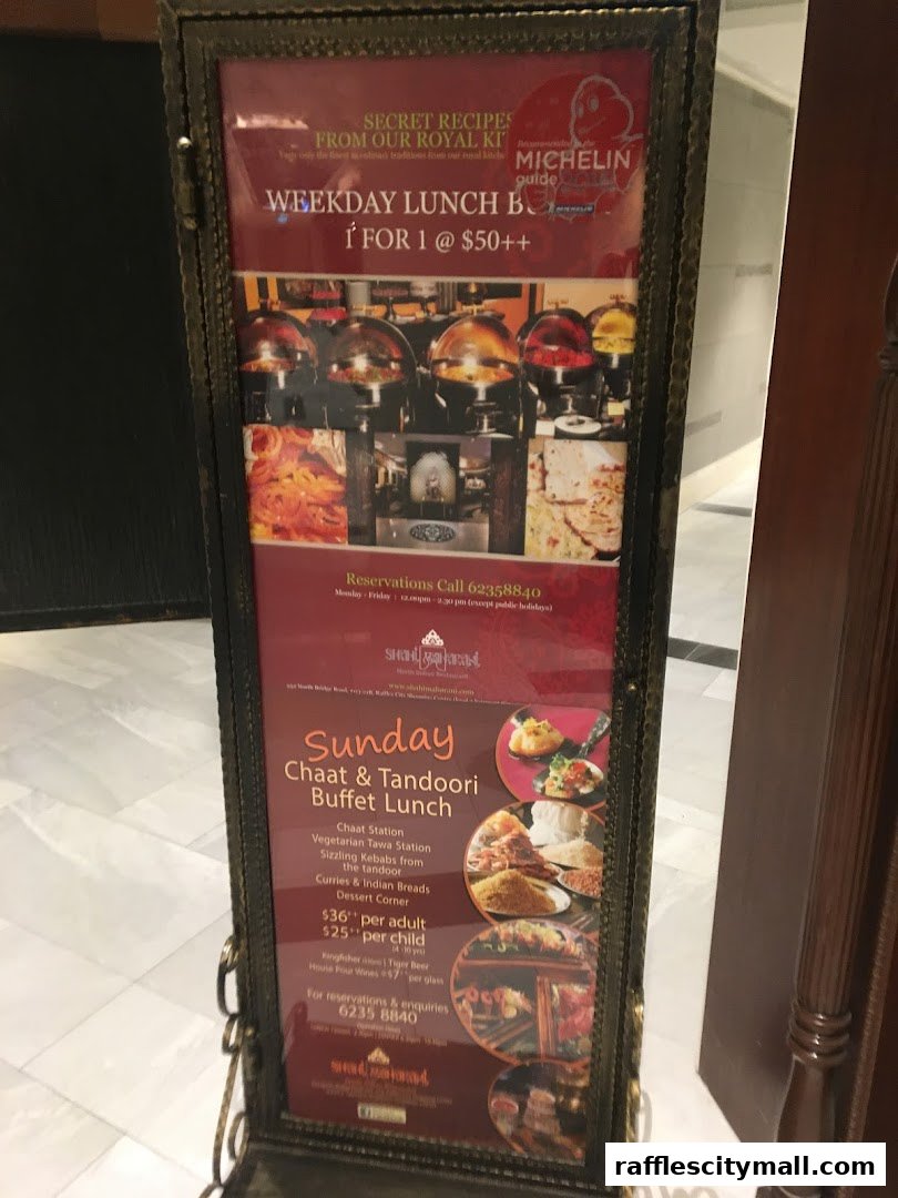 A framed menu board advertising weekday lunch and Sunday chaat & tandoori buffet.