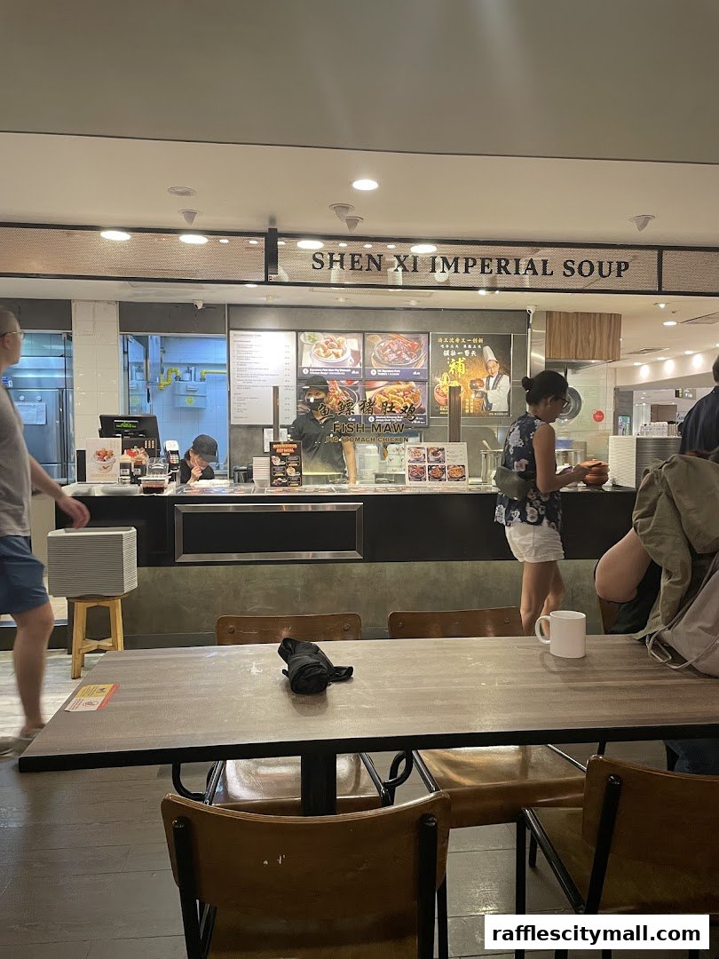 Customers at Shen Xi Imperial Soup, a restaurant with a visible menu and food displays.