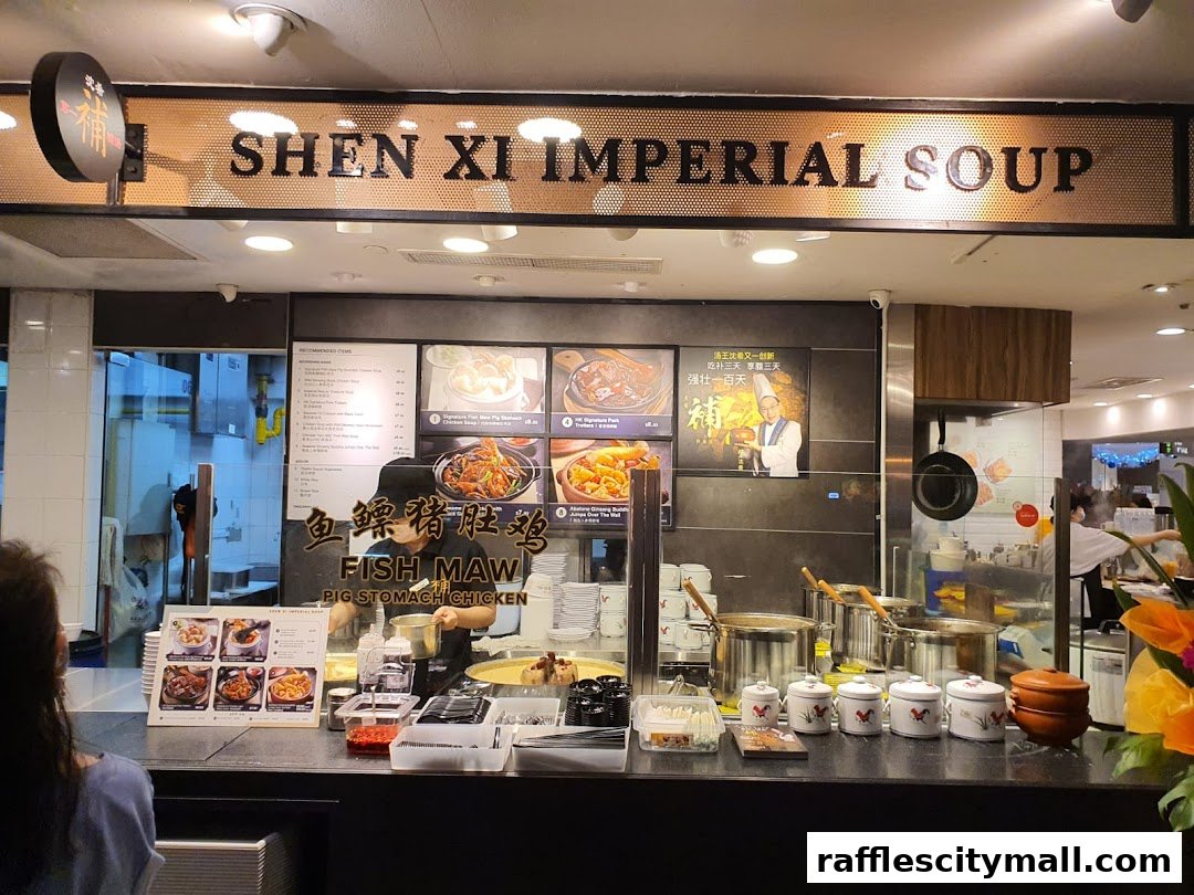 A food stall counter with a menu, ingredients, and staff preparing food.