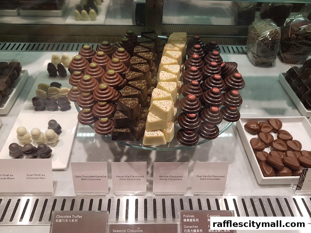 A display of assorted Godiva chocolates, including truffles and flavored chocolates.