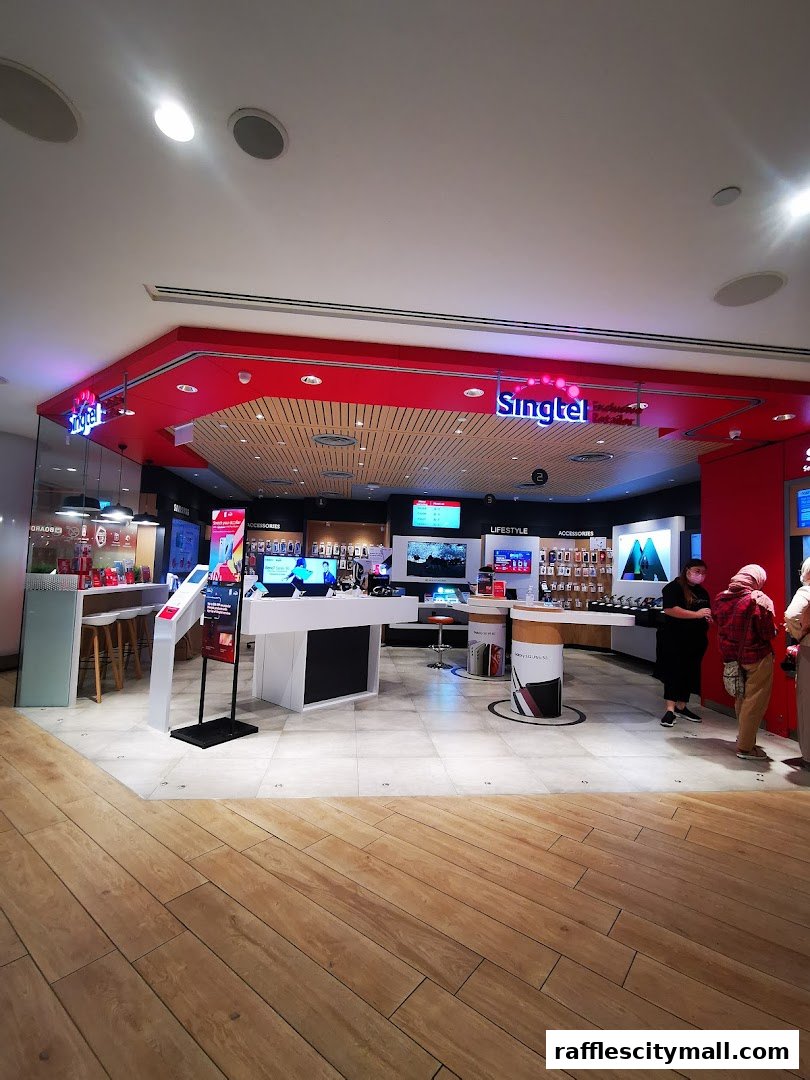 The Singtel Exclusive Retailer Raffles City G-Force shop front with displays of phones and accessories.