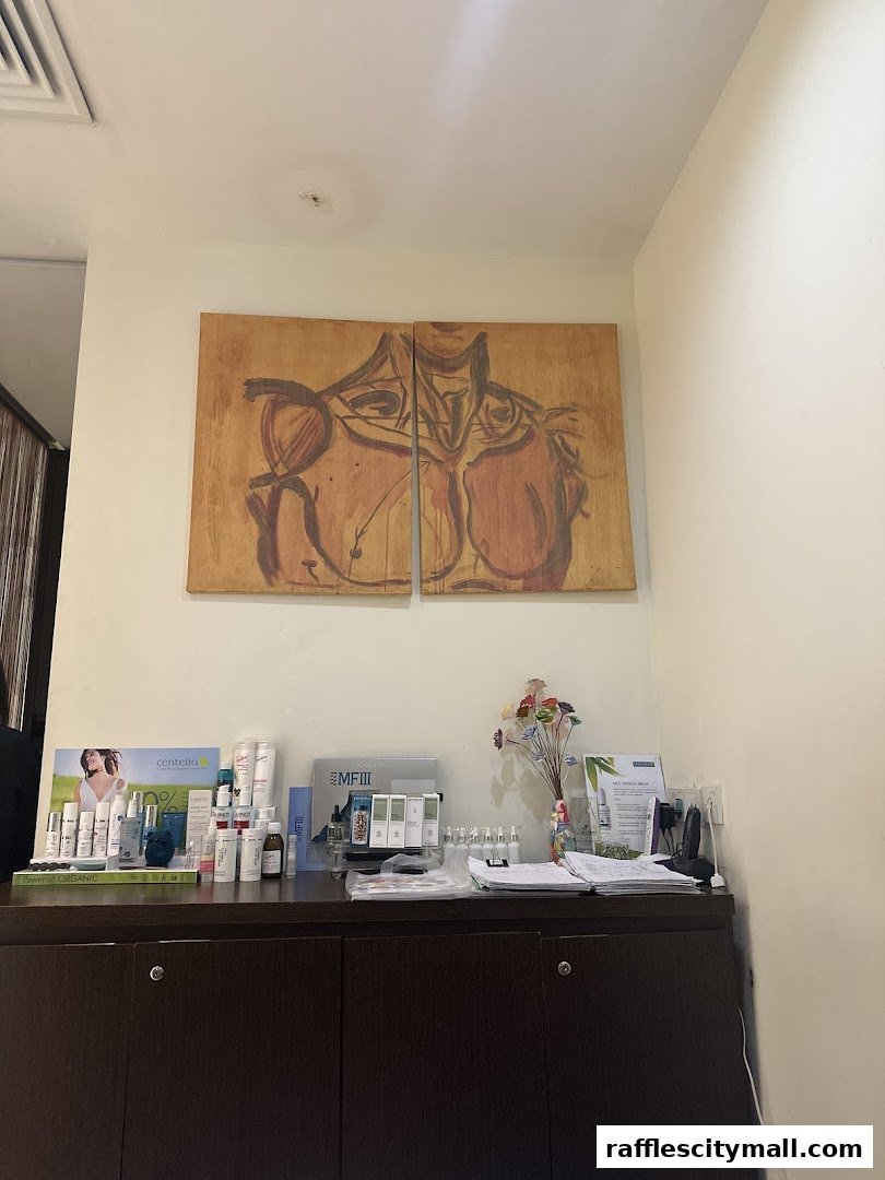 A counter display of skincare products and artwork in a spa setting.