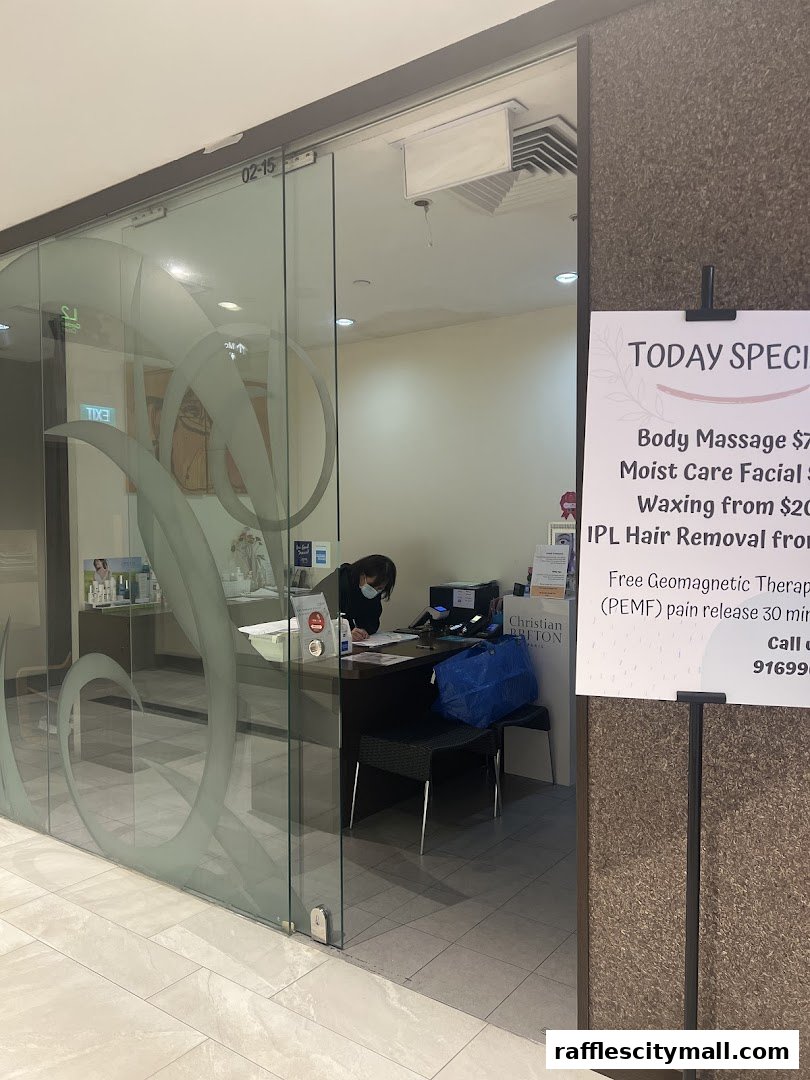 A spa reception area with a sign advertising today's specials and a staff member at the desk.
