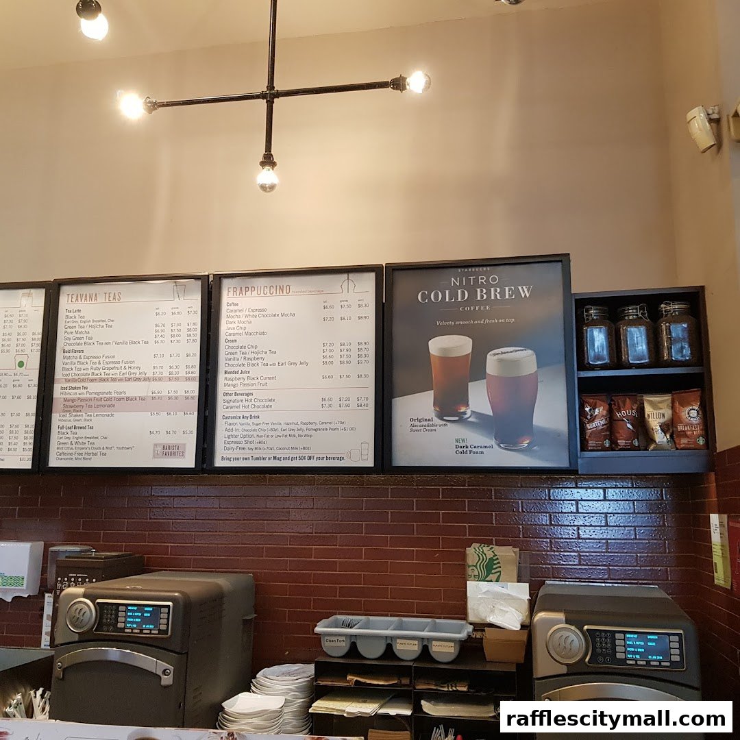 Starbucks menu boards displaying Teavana Teas, Frappuccinos, and Nitro Cold Brew.