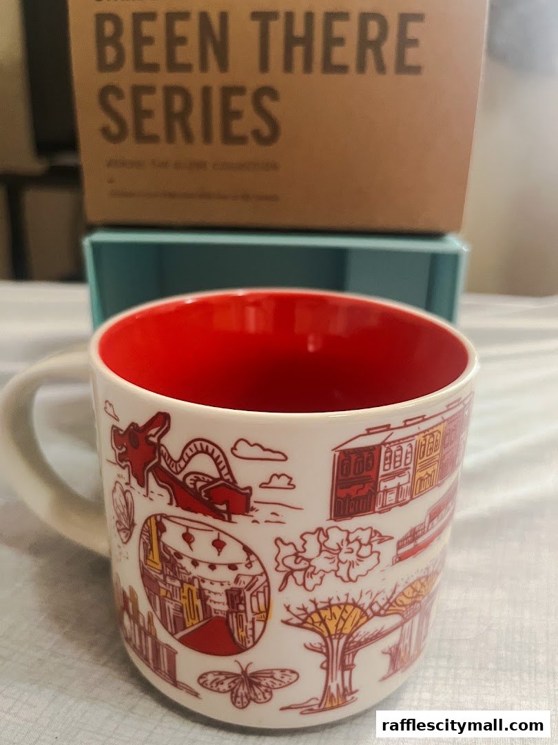 A Starbucks mug with a red interior and a design featuring Singapore landmarks.
