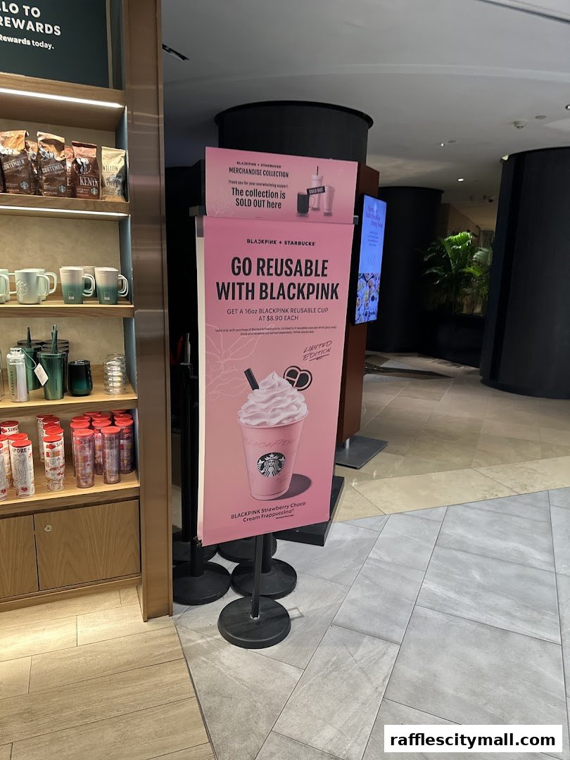 A sign promoting a Starbucks BLACKPINK reusable cup and Frappuccino.