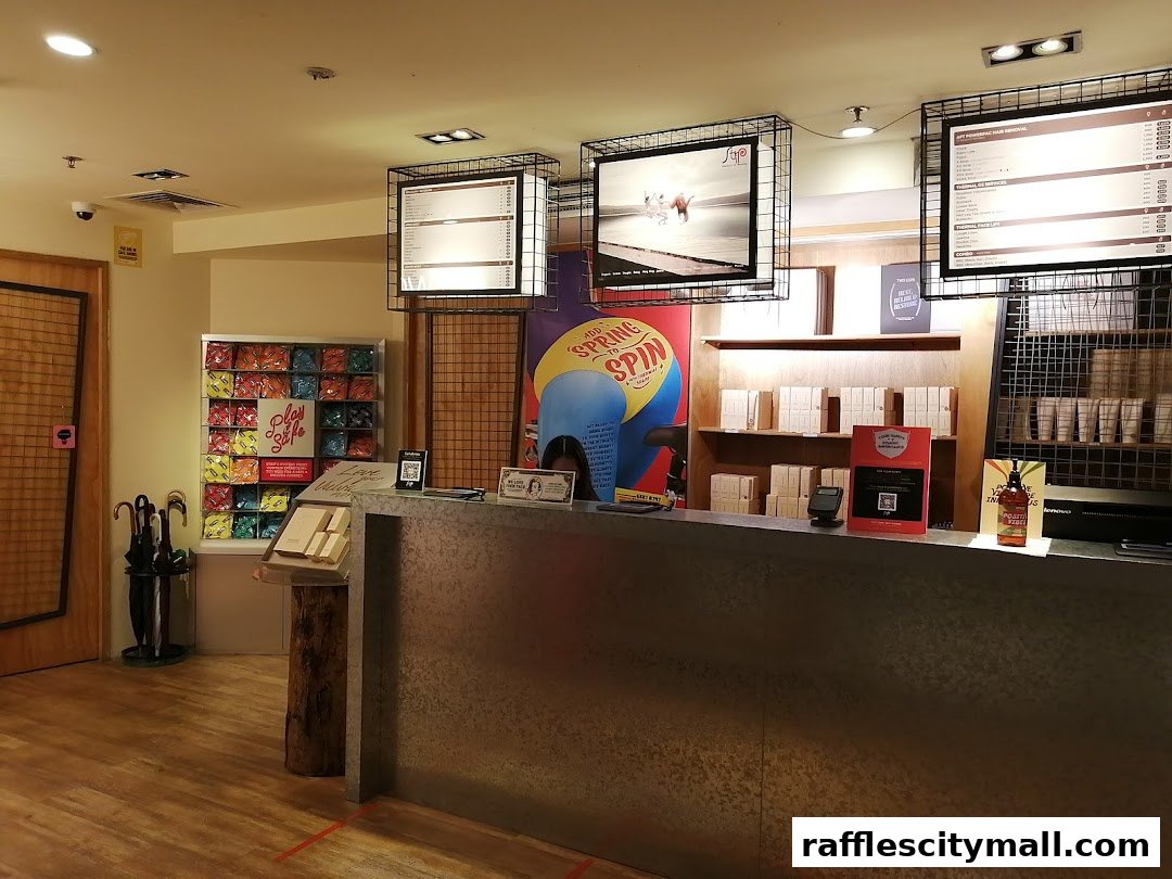 Interior view of a shop with a counter, product displays, and promotional posters.