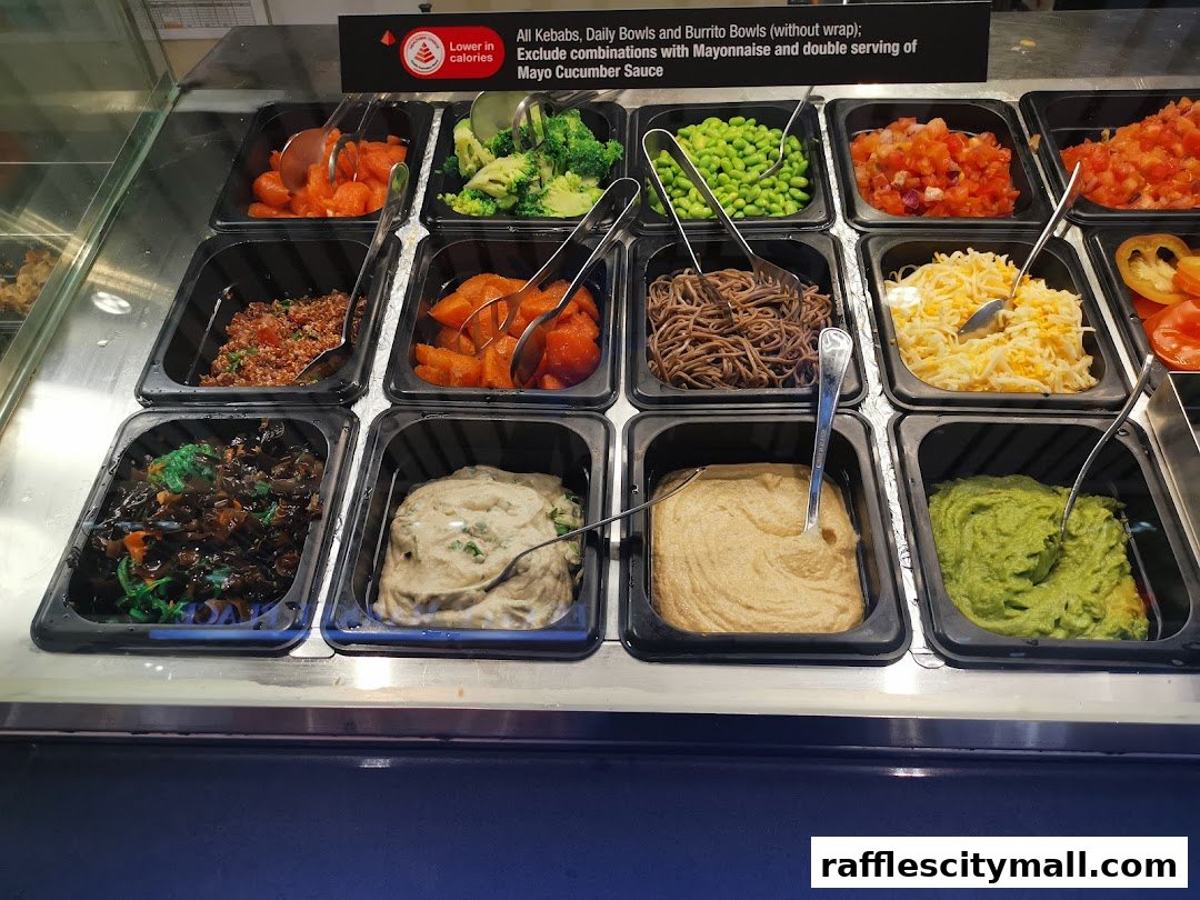 A display of various fresh ingredients in black containers, ready for meal preparation.