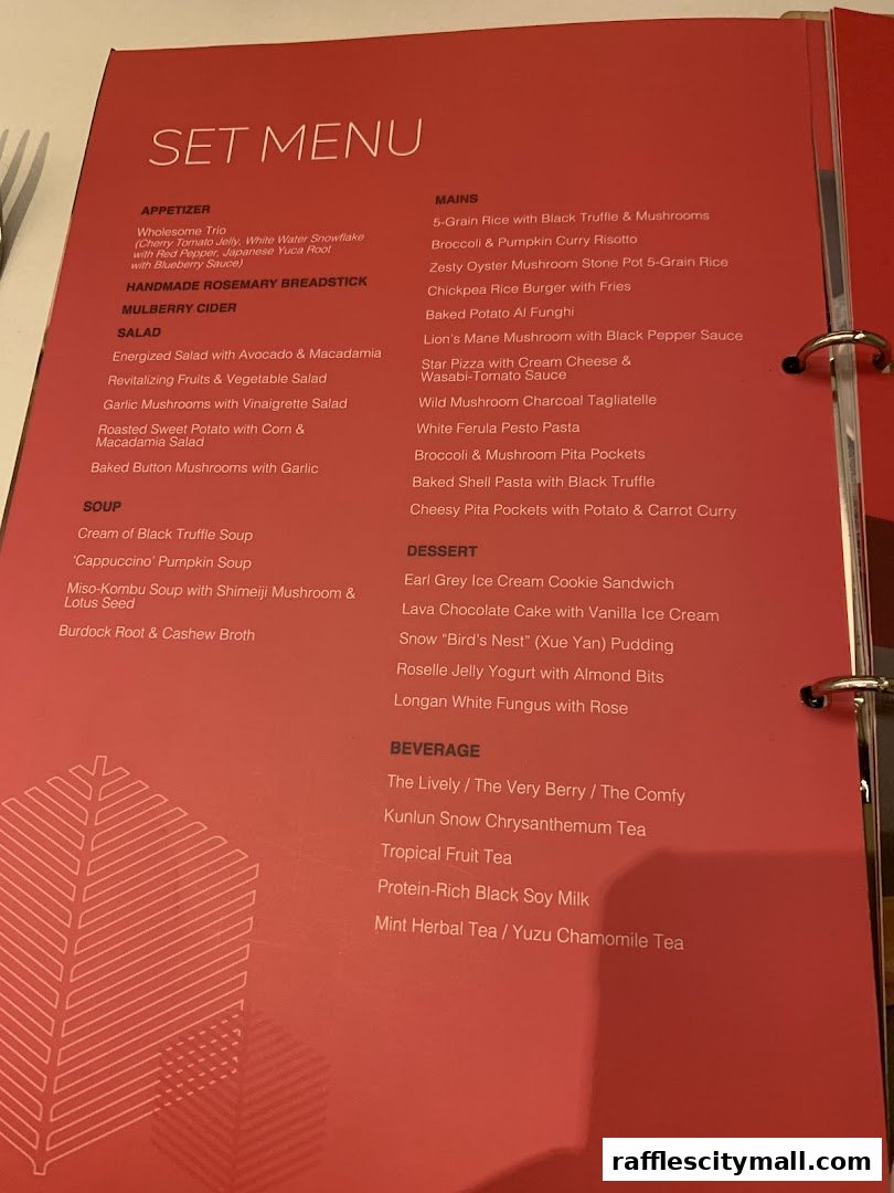A red menu with a set menu, including appetizers, mains, desserts, and beverages.