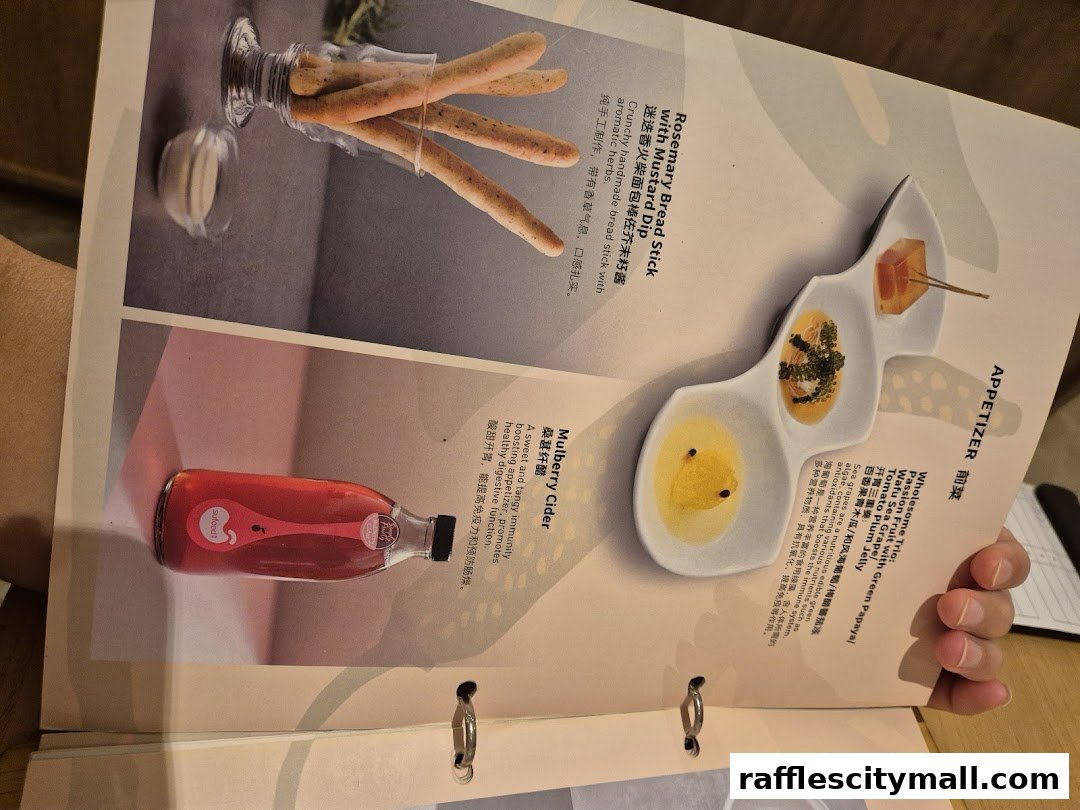 A menu page from Sufood featuring appetizers like breadsticks, a trio of small dishes, and mulberry cider.