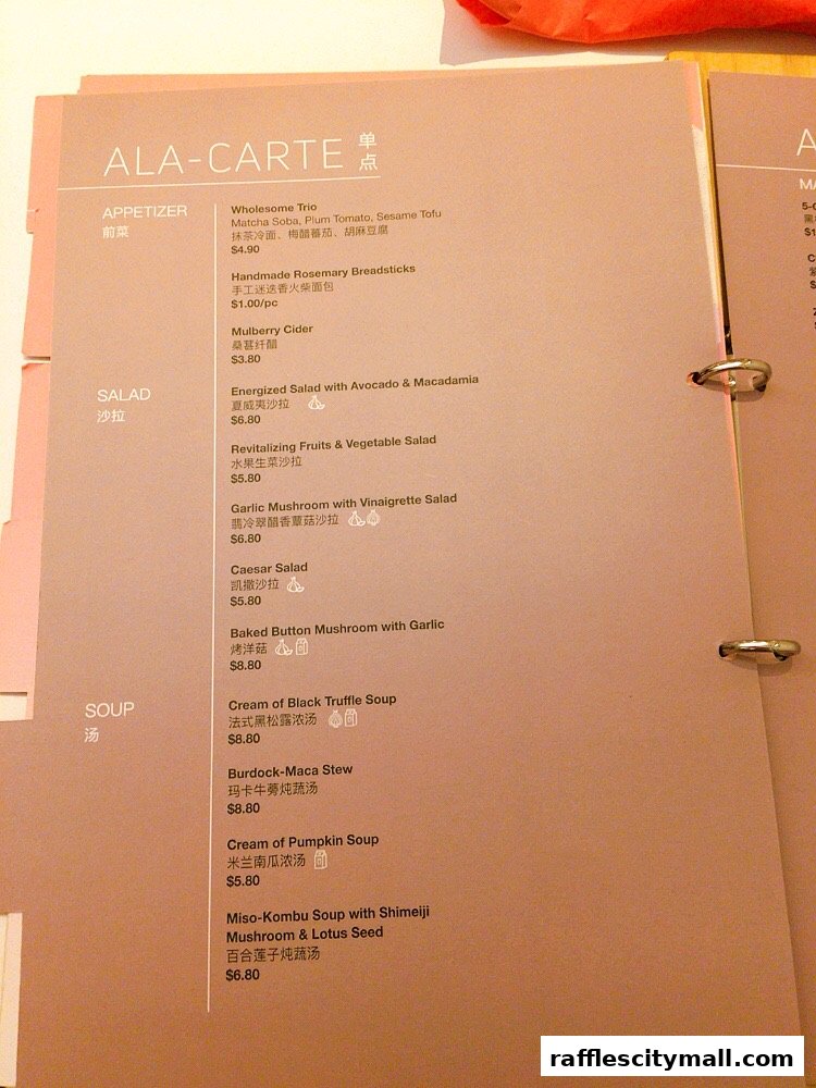 A close-up view of a Sufood ala-carte menu with appetizers, salads, and soups.