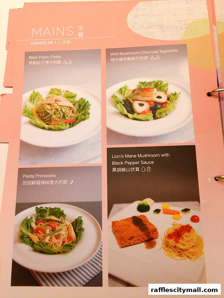 A menu page showcasing four main course dishes with accompanying images.