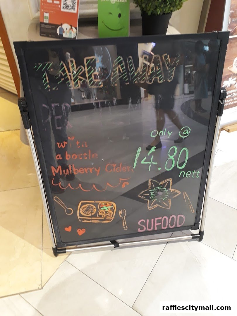 A chalkboard sign advertising a takeaway deal for Mulberry Cider at Sufood.