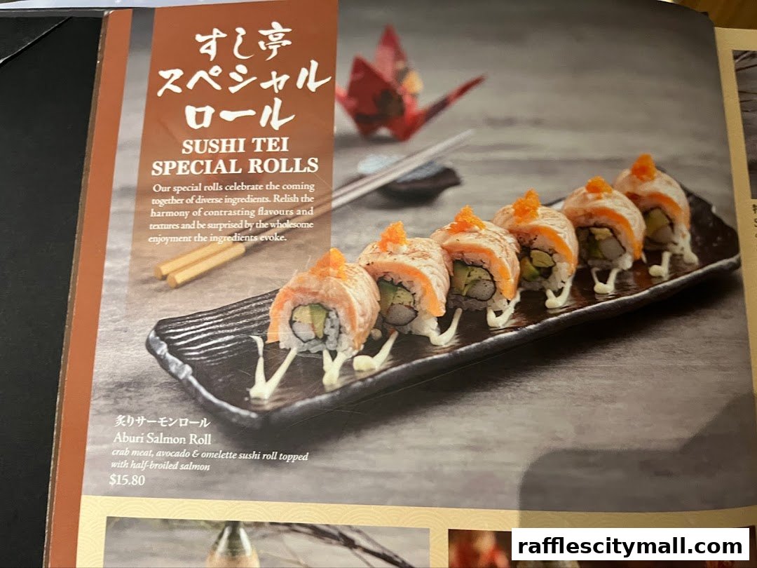 A close-up of a menu featuring Sushi Tei's special Aburi Salmon Roll.