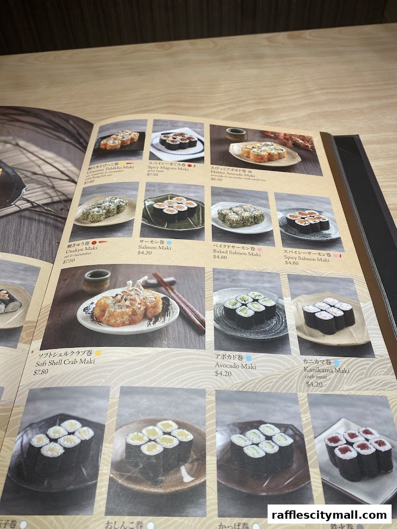 A menu from Sushi Tei featuring various types of sushi rolls with appetizing images and prices.