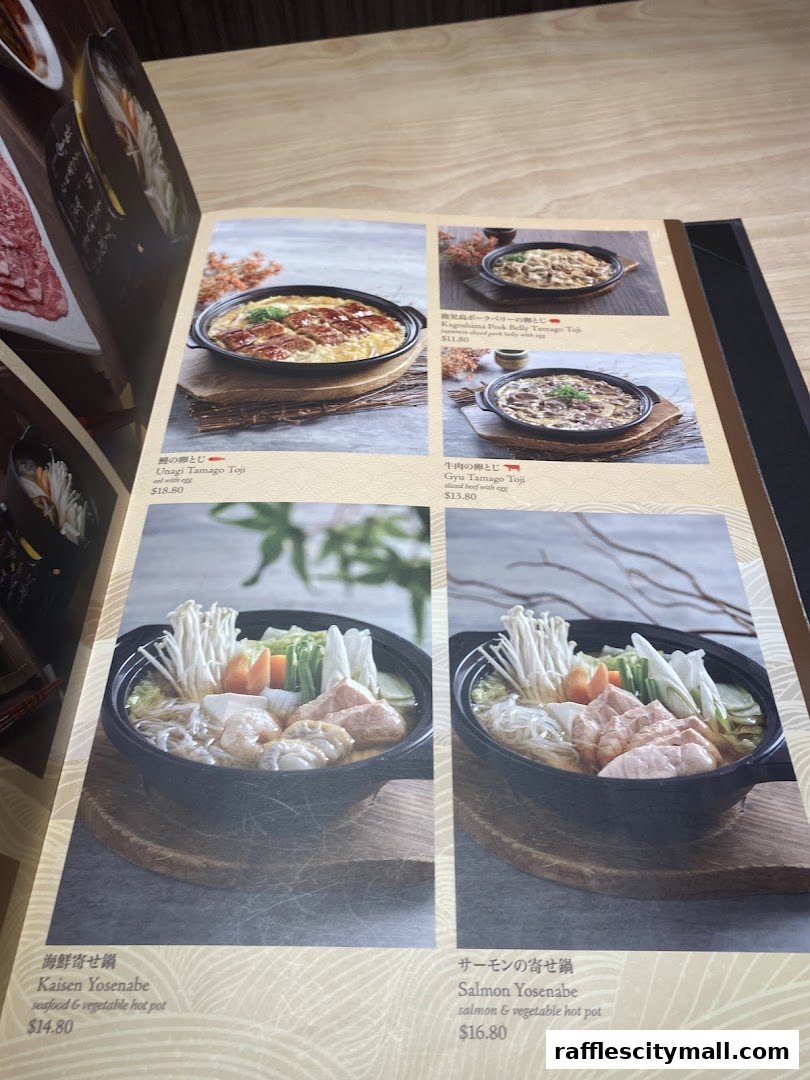 A menu from Sushi Tei featuring various Japanese dishes with appetizing photos.