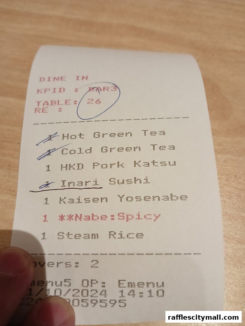 A receipt from Sushi Tei listing various Japanese food and drink items ordered.