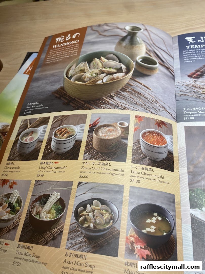 A menu from Sushi Tei featuring various Japanese dishes, including steamed egg custards and miso soups.