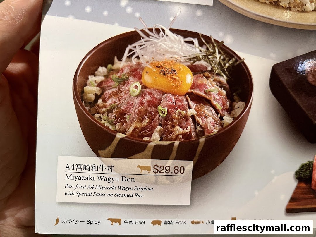 A close-up of a Miyazaki Wagyu Don dish with its description and price.