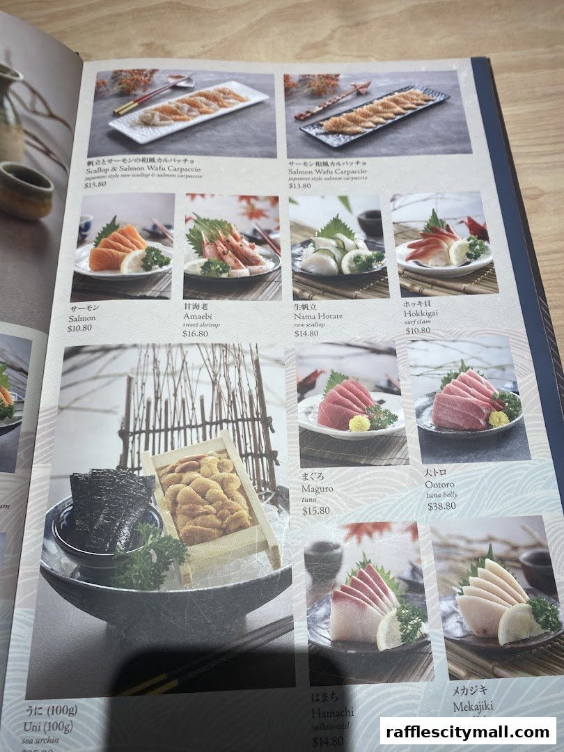A menu from Sushi Tei featuring various sushi and sashimi dishes with prices.