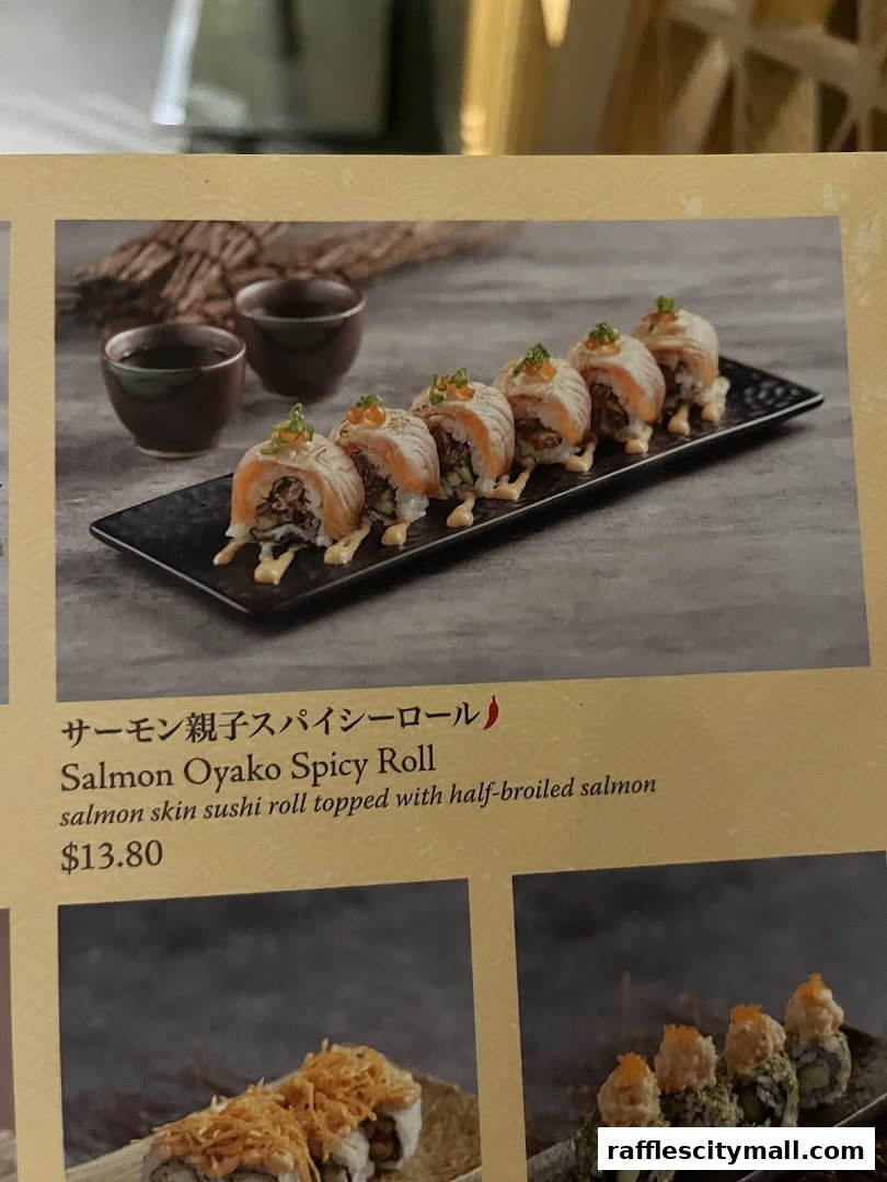 A menu item featuring Salmon Oyako Spicy Roll with half-broiled salmon.