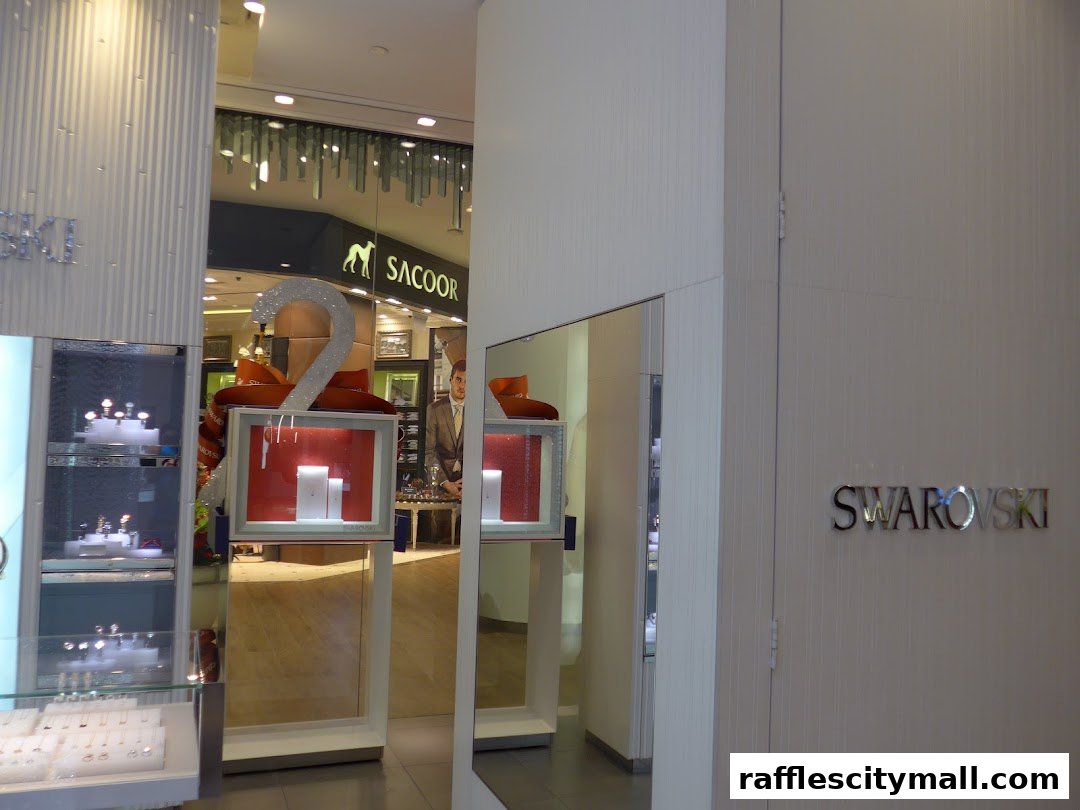 The exterior of a Swarovski store with illuminated displays and signage.