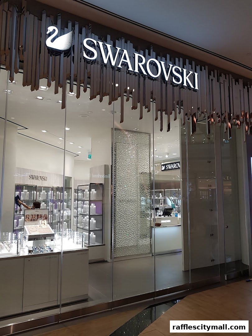 The entrance of a Swarovski store with sparkling displays and the iconic swan logo.