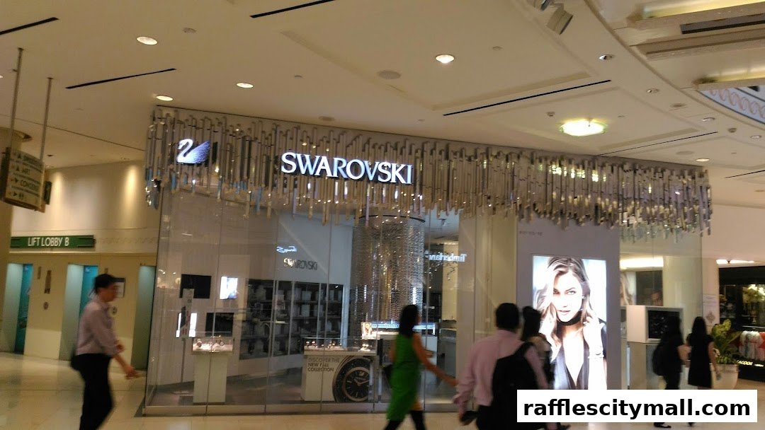 The exterior of a Swarovski store in a mall, featuring a modern facade and displays.